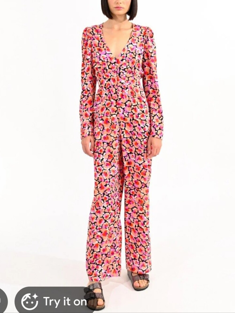 Lili Sidonio Long-sleeved V-neck jumpsuit with floral pattern. Size Large.